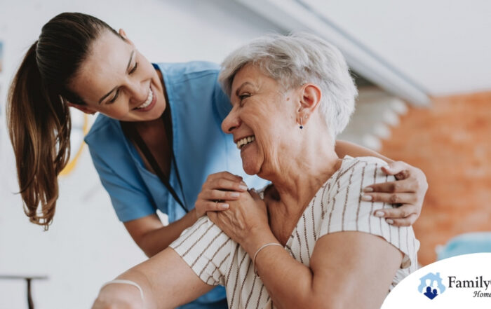 A female caregiver helping an older woman with stroke recovery at home.